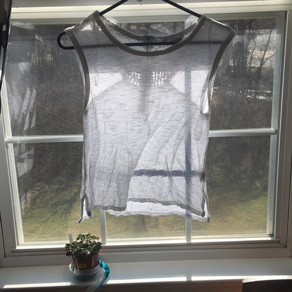 A white sheer sleeve tank top